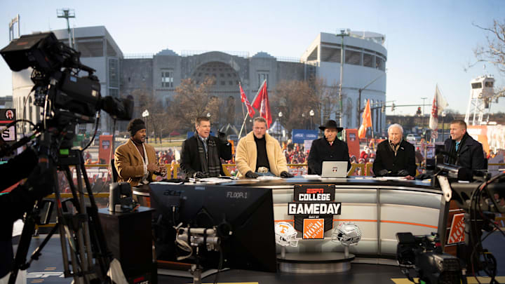 ESPN cast, from left, Desmond Howard, Rece Davis, Pat McAfee, Nick Saban, Lee Corso and Kirk Herbstreit sit on the set of College GameDay prior to the College Football Playoff first round game between the Ohio State Buckeyes and Tennessee Volunteers in Columbus on Dec. 21, 2024.