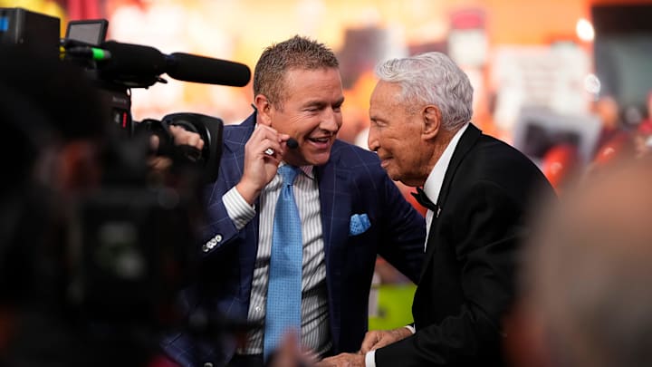 Kirk Herbstreit talks to Lee Corso on the set of ESPN College GameDay