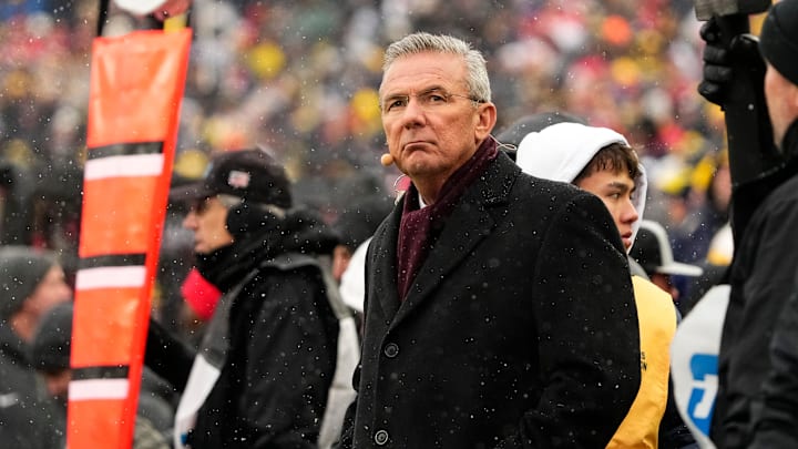 Former head coach Urban Meyer watches from the sideline during the NCAA football game between the Michigan Wolverines and the Ohio State Buckeyes at Michigan Stadium in Ann Arbor, Michigan.
