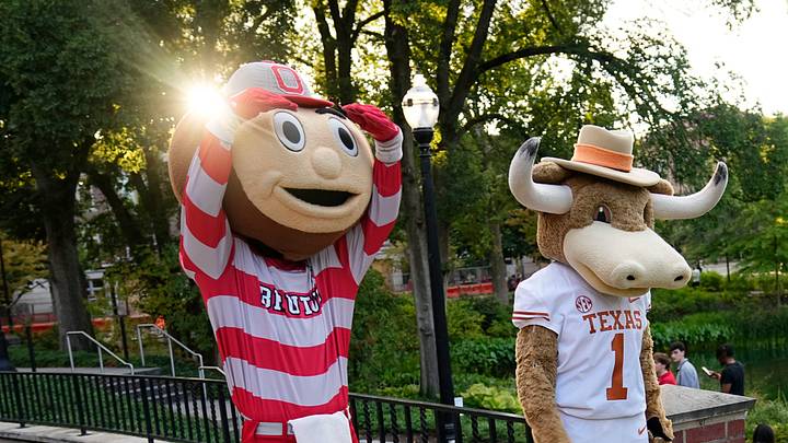 Ohio State mascot, Brutus, and University of Texas mascot, Hook 'Em, interact during a filming of the Joel Klatt Show on Ohio State's campus on Aug. 28, 2025. The Buckeyes' kick off the 2025 season against the Longhorns at Ohio Stadium on Aug. 30. Ohio State mascot, Brutus, and University of Texas mascot, Hook 'Em, interact during a filming of the Joel Klatt Show on Ohio State's campus on Aug. 28, 2025. The Buckeyes' kick off the 2025 season against the Longhorns at Ohio Stadium on Aug. 30.
