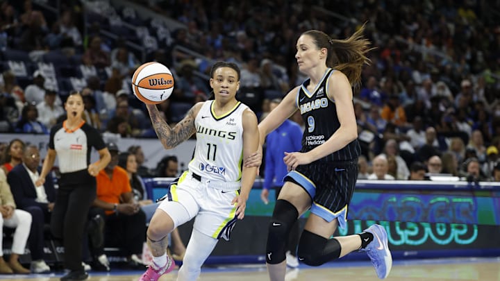 Dallas Wings guard JJ Quinerly drives to the basket against Chicago Sky guard Rebecca Allen.