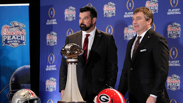 Dec 30, 2022; Atlanta, GA, USA;  Ohio State Buckeyes head coach Ryan Day and Georgia Bulldogs head coach Kirby Smart stand with the George P. Crumbley Trophy following a press conference prior to the Peach Bowl College Football Playoff semifinal at the Westin Hotel in Atlanta. Mandatory Credit: Adam Cairns-The Columbus Dispatch

Football Ohio State Georgia Coaches Press Conference