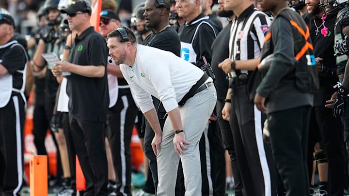 Oct 12, 2024; Eugene, Oregon, USA; Oregon Ducks head coach Dan Lanning watches during the first half of the NCAA football game against the Ohio State Buckeyes at Autzen Stadium