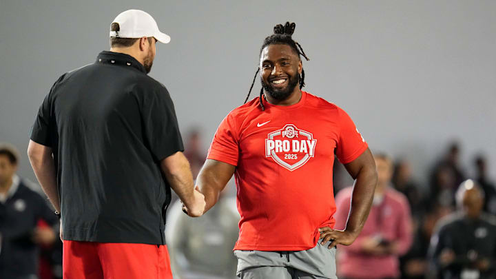 Ohio State Buckeyes offensive lineman Donovan Jackson (74) gets a high five from current Ohio State offensive line coach Tyler Bowen during the pro day for NFL scouts at the Woody Hayes Athletic Cente on March 26, 2025.