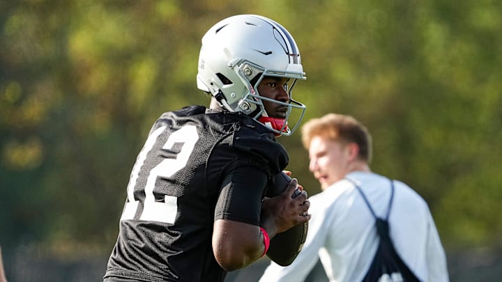 Aug 1, 2024; Columbus, OH, USA; Ohio State Buckeyes quarterback Air Noland (12) drops back to pass during football camp at the Woody Hayes Athletic Complex.