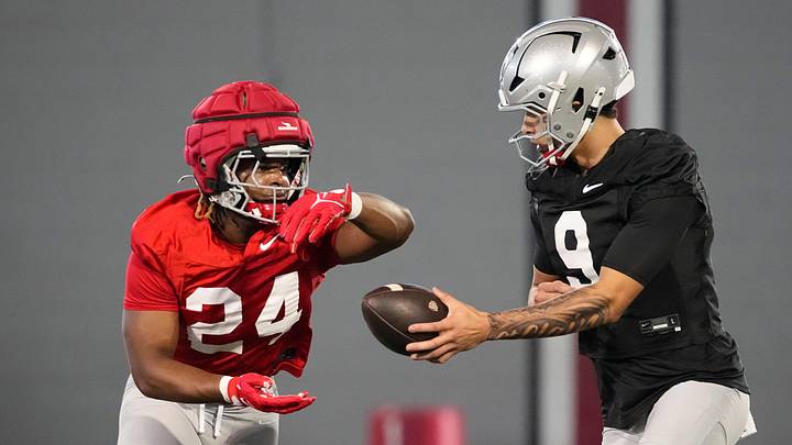 Ohio State Buckeyes quarterback Tavien St. Clair (9) hands off to running back Sam Williams-Dixon (24) during spring football practice at the Woody Hayes Athletic Center on March 17, 2025. Ohio State Buckeyes quarterback Tavien St. Clair (9) hands off to running back Sam Williams-Dixon (24) during spring football practice at the Woody Hayes Athletic Center on March 17, 2025.
