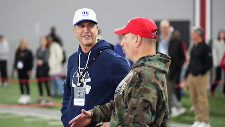 New York Giants head coach John Harbaugh talks to Ohio State associate athletic director for football sports performance Mickey Marotti during Pro Day for NFL scouts at the Woody Hayes Athletics Center on March 25, 2026.
