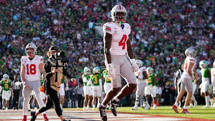 Ohio State Buckeyes wide receiver Jeremiah Smith (4) celebrates a touchdown during the first half of the College Football Playoff quarterfinal against the Oregon Ducks at the Rose Bowl in Pasadena, Calif. on Jan. 1, 2025.