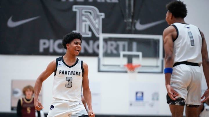 Pickerington North's JR Bates (3) celebrates with Arness Lawson (1) on Friday, Feb. 14, 2025.