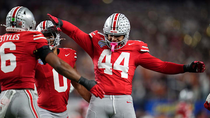 Ohio State Buckeyes defensive end JT Tuimoloau (44) and safety Sonny Styles (6) celebrates a defensive stop during the first half of the Cotton Bowl Classic College Football Playoff semifinal game against the Texas Longhorns at AT&T Stadium in Arlington, Texas on Jan. 10, 2025.