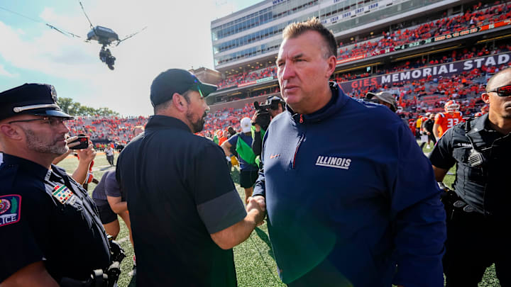 Ohio State Buckeyes head coach Ryan Day shakes hands with Illinois Fighting Illini head coach Bret Bielema following the Buckeyes' 34-16 win in the NCAA football game at Gies Memorial Stadium in Champaign on Oct. 11, 2025.