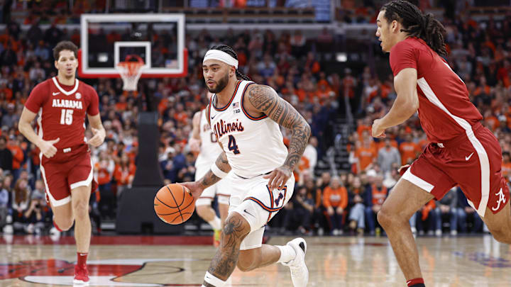 Nov 19, 2025; Chicago, Illinois, USA; Illinois Fighting Illini guard Kylan Boswell (4) drives to the basket against the Alabama Crimson Tide during the first half at United Center. Mandatory Credit: Kamil Krzaczynski-Imagn Images