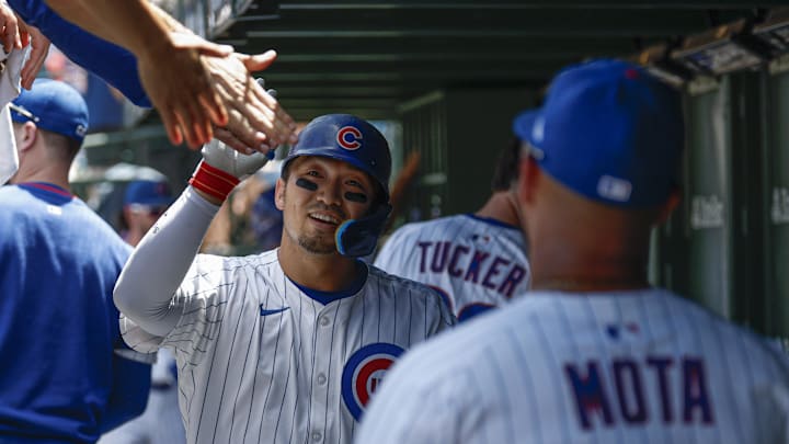 Jun 22, 2025; Chicago, Illinois, USA; Chicago Cubs right fielder Seiya Suzuki (27) celebrates with teammates in the dugout after hitting a solo home run against the Seattle Mariners during the first inning at Wrigley Field. Jun 22, 2025; Chicago, Illinois, USA; Chicago Cubs right fielder Seiya Suzuki (27) celebrates with teammates in the dugout after hitting a solo home run against the Seattle Mariners during the first inning at Wrigley Field.