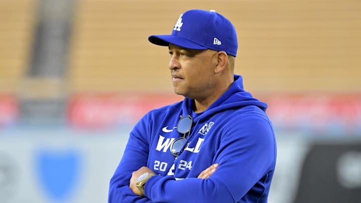 Oct 24, 2024; Los Angeles, CA, USA;  Los Angeles Dodgers manager Dave Roberts (30) looks on during the team workout prior to game one of the World Series against the New York Yankees at Dodger Stadium. Mandatory Credit: Jayne Kamin-Oncea-Imagn Images
