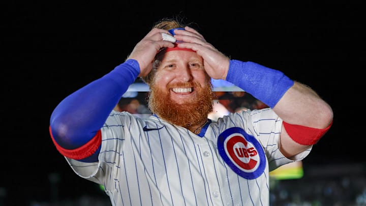 May 13, 2025; Chicago, Illinois, USA; Chicago Cubs first baseman Justin Turner (3) smiles after hitting a walk-off two-run double against the Miami Marlins during the ninth inning at Wrigley Field. Mandatory Credit: Kamil Krzaczynski-Imagn Images