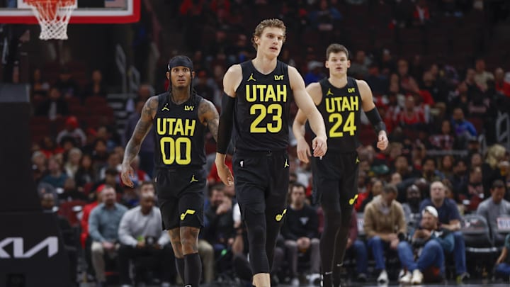 Nov 6, 2023; Chicago, Illinois, USA; Utah Jazz forward Lauri Markkanen (23), Utah Jazz guard Jordan Clarkson (00) and Utah Jazz center Walker Kessler (24) walk on the court during the first half of a basketball game against the Chicago Bulls at United Center. Mandatory Credit: Kamil Krzaczynski-Imagn Images