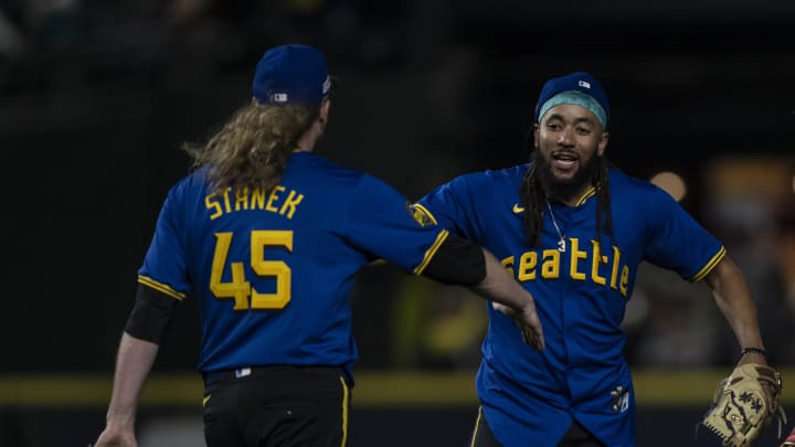 Seattle Mariners shortstop J.P. Crawford (3) and relief pitcher Ryne Stanek (45) celebrate after a game against the Texas Rangers at T-Mobile Park on June 14. Seattle Mariners shortstop J.P. Crawford (3) and relief pitcher Ryne Stanek (45) celebrate after a game against the Texas Rangers at T-Mobile Park on June 14.
