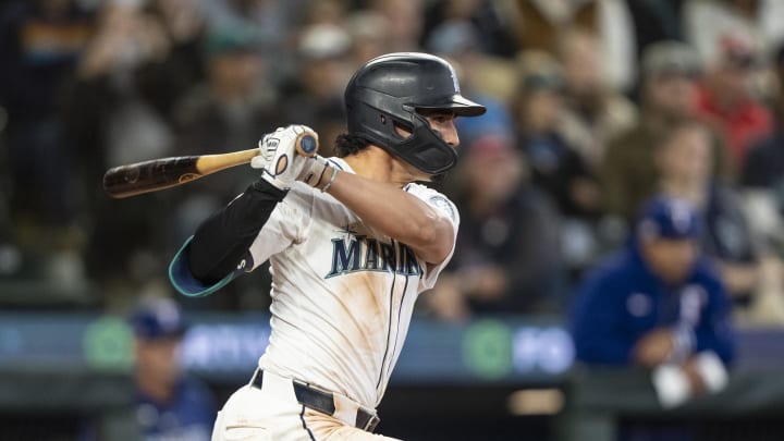 Seattle Mariners third baseman Josh Rojas (4) hits a two-run single during the eighth inning against the Texas Rangers at T-Mobile Park on June 15.