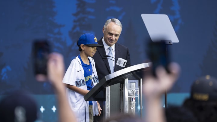 MLB commissioner Rob Manfred, right, and Tiago Viernes announce the Seattle Mariners pick during the first round of the MLB Draft at Lumen Field in 2023.