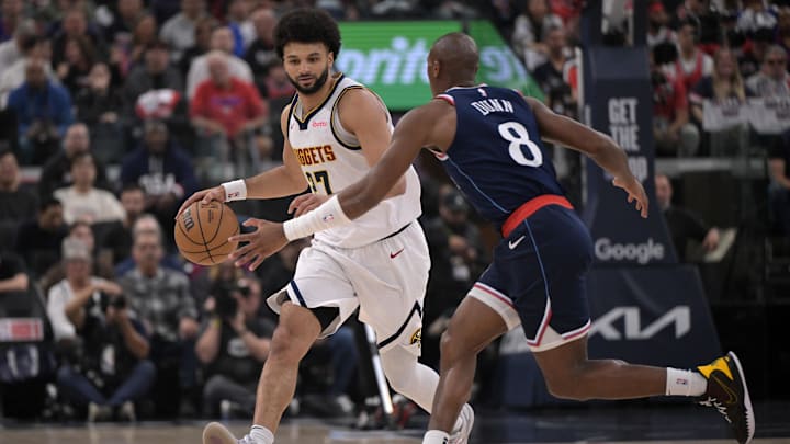 Apr 26, 2025; Inglewood, California, USA; Denver Denver Nuggets guard Jamal Murray (27) is defended by Los Angeles Clippers guard Kris Dunn (8) in the first half of game four of round one of the 2024 NBA Playoffs at Intuit Dome. Mandatory Credit: Jayne Kamin-Oncea-Imagn Images