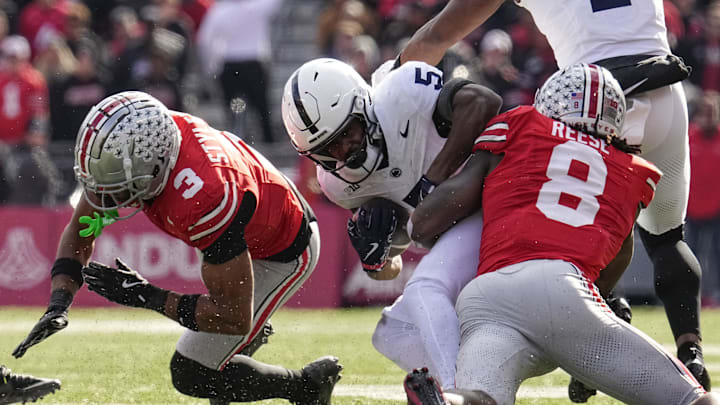 Ohio State Buckeyes linebacker Arvell Reese (8) hits Penn State Nittany Lions wide receiver Devonte Ross (5) beside cornerback Lorenzo Styles Jr. (3) during the NCAA football game at Ohio Stadium in Columbus on Nov. 1, 2025. Ohio State Buckeyes linebacker Arvell Reese (8) hits Penn State Nittany Lions wide receiver Devonte Ross (5) beside cornerback Lorenzo Styles Jr. (3) during the NCAA football game at Ohio Stadium in Columbus on Nov. 1, 2025.