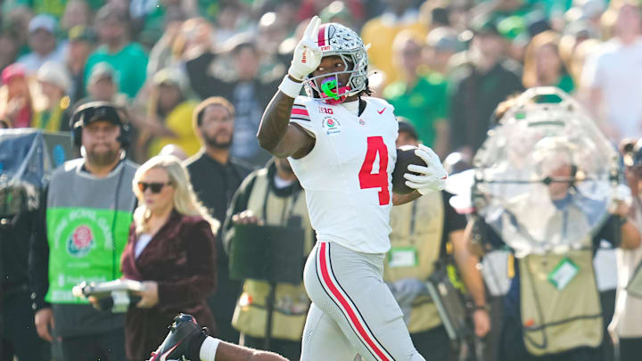 Ohio State Buckeyes wide receiver Jeremiah Smith (4) scores a touchdown during the first half of the College Football Playoff quarterfinal against the Oregon Ducks at the Rose Bowl in Pasadena, Calif. on Jan. 1, 2025.
