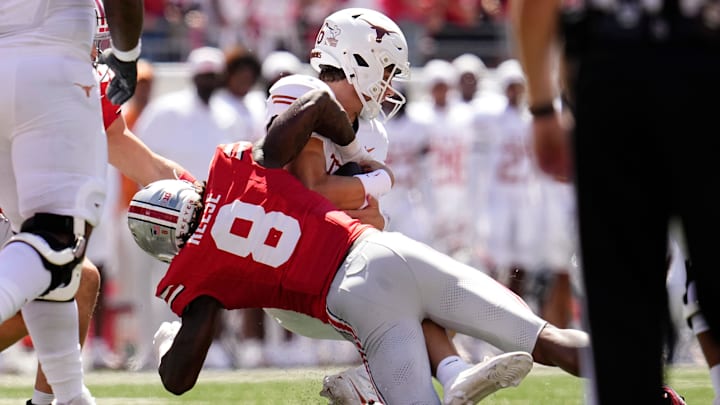 Ohio State Buckeyes linebacker Arvell Reese (8) tackles Texas Longhorns quarterback Arch Manning (16) during the NCAA football game at Ohio Stadium on Aug. 30, 2025.