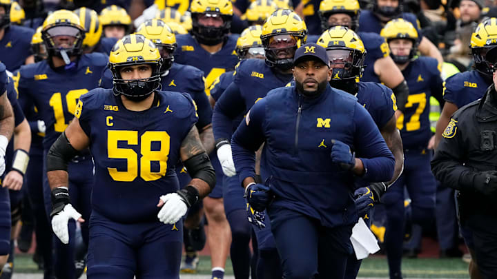 Michigan Wolverines head coach Sherrone Moore leads his team onto the field for the NCAA football game against the Ohio State Buckeyes at Michigan Stadium in Ann Arbor, Mich. on Nov. 29, 2025. Ohio State won 27-9.