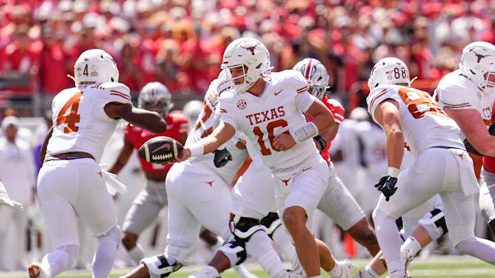 Texas Longhorns quarterback Arch Manning (16) hands off to running back CJ Baxter (4) during the NCAA football game against the Ohio State Buckeyes at Ohio Stadium on Aug. 30, 2025. Texas Longhorns quarterback Arch Manning (16) hands off to running back CJ Baxter (4) during the NCAA football game against the Ohio State Buckeyes at Ohio Stadium on Aug. 30, 2025.