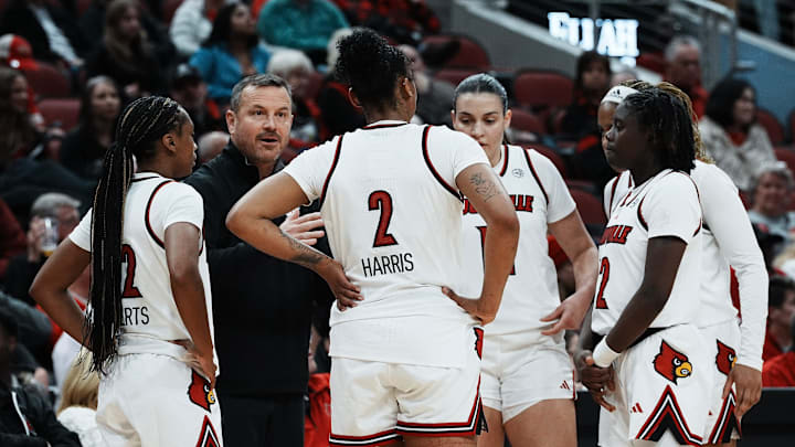 Louisville head coach Jeff Walz instructed his team against Oklahoma during their game at the KFC Yum! Center in Louisville, Ky. on Dec. 4, 2024.