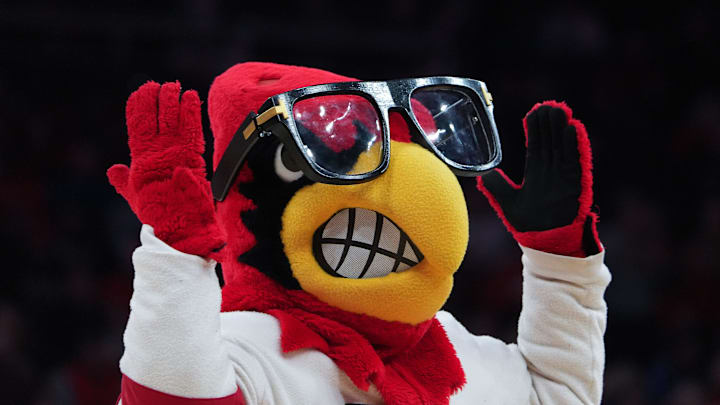 Louie The Cardinal wears glasses to honor head coach Pat Kelsey during their game against Duke at the KFC Yum! Center in Louisville, Ky. on Dec. 8, 2024.