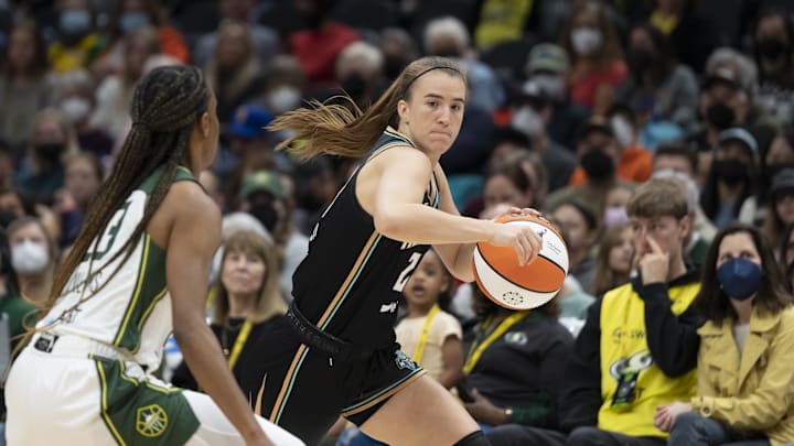 May 29, 2022; Seattle, Washington, USA; New York Liberty guard Sabrina Ionescu (20) dribbles the ball against Seattle Storm guard Kiana Williams (23) during the second half at Climate Pledge Arena. Mandatory Credit: Stephen Brashear-Imagn Images