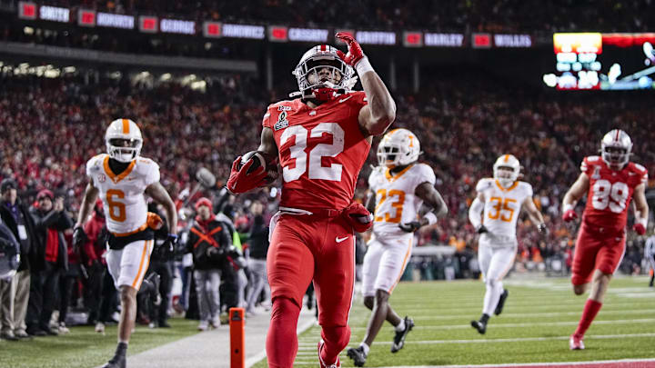 Ohio State Buckeyes running back TreVeyon Henderson (32) runs for a touchdown during the first half of the College Football Playoff first round game against the Tennessee Volunteers at Ohio Stadium in Columbus on Dec. 21, 2024.