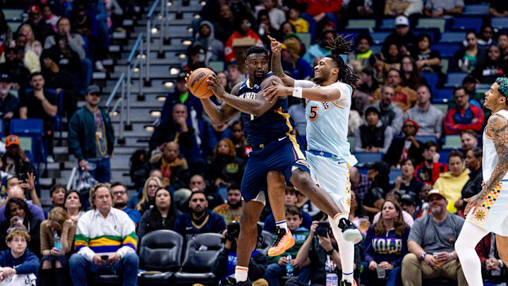 Feb 23, 2025; New Orleans, Louisiana, USA; New Orleans Pelicans forward Zion Williamson (1) grabs a rebound against San Antonio Spurs guard Stephon Castle (5) during the second half at Smoothie King Center. Mandatory Credit: Stephen Lew-Imagn Images Feb 23, 2025; New Orleans, Louisiana, USA; New Orleans Pelicans forward Zion Williamson (1) grabs a rebound against San Antonio Spurs guard Stephon Castle (5) during the second half at Smoothie King Center. Mandatory Credit: Stephen Lew-Imagn Images