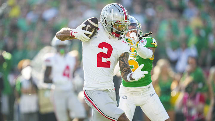 Ohio State Buckeyes wide receiver Emeka Egbuka (2) catches a touchdown in front of Oregon Ducks defensive back Brandon Johnson (3) during the first half of the College Football Playoff quarterfinal at the Rose Bowl in Pasadena, Calif. on Jan. 1, 2025. Ohio State Buckeyes wide receiver Emeka Egbuka (2) catches a touchdown in front of Oregon Ducks defensive back Brandon Johnson (3) during the first half of the College Football Playoff quarterfinal at the Rose Bowl in Pasadena, Calif. on Jan. 1, 2025.
