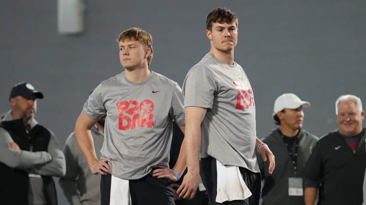 Mar 20, 2024; Columbus, Ohio, USA; Ohio State Buckeyes quarterbacks Will Howard and Devin Brown take Mar 20, 2024; Columbus, Ohio, USA; Ohio State Buckeyes quarterbacks Will Howard and Devin Brown take