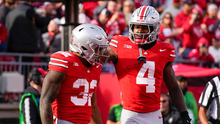 Ohio State Buckeyes running back TreVeyon Henderson (32) celebrates with wide receiver Jeremiah Smith (4) after Henderson scored a touchdown in the second half at Ohio Stadium on Saturday, Nov. 9, 2024 in Columbus, Ohio.