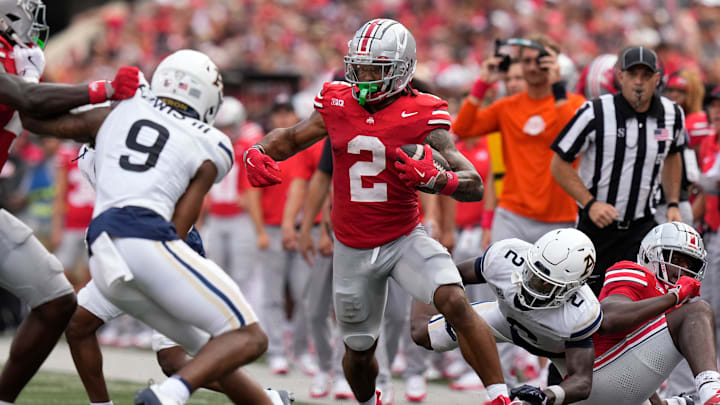 Aug 31, 2024; Columbus, OH, USA; Ohio State Buckeyes wide receiver Emeka Egbuka (2) runs past Akron Zips defensive back Paul Lewis III (9) after making a catch during the first half of the NCAA football game at Ohio Stadium.