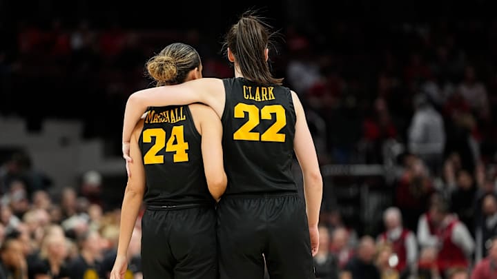 Jan 23, 2023: Iowa Hawkeyes guard Caitlin Clark puts her arm around guard Gabbie Marshall.