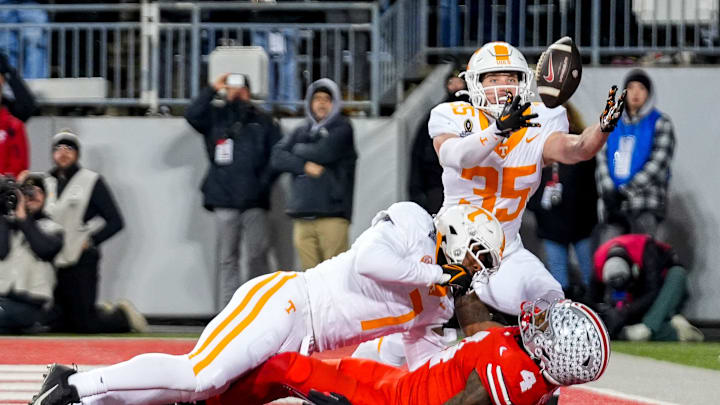Tennessee Volunteers defensive back Will Brooks (35) intercepts a pass intended for Ohio State Buckeyes wide receiver Jeremiah Smith (4) in the first half at Ohio Stadium on Saturday, Dec. 21, 2024 in Columbus, Ohio. Tennessee Volunteers defensive back Will Brooks (35) intercepts a pass intended for Ohio State Buckeyes wide receiver Jeremiah Smith (4) in the first half at Ohio Stadium on Saturday, Dec. 21, 2024 in Columbus, Ohio.