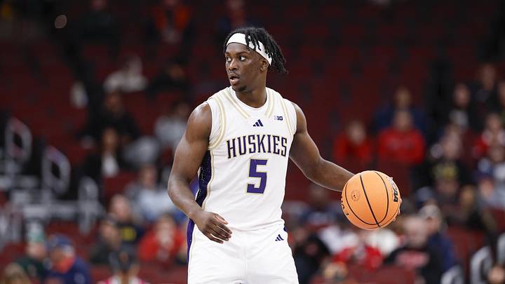 Mar 11, 2026; Chicago, IL, USA; Washington Huskies guard Zoom Diallo (5) brings the ball up court against the Southern California Trojans during the second half at United Center. Mandatory Credit: Kamil Krzaczynski-Imagn Images
