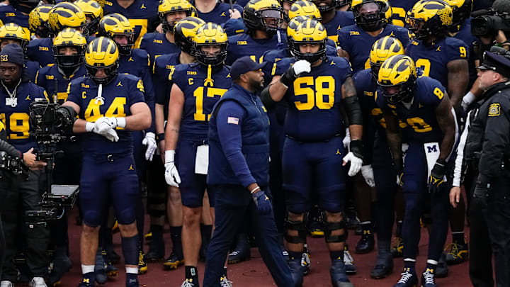 Michigan Wolverines head coach Sherrone Moore prepares to lead his team onto the field for the NCAA football game against the Ohio State Buckeyes at Michigan Stadium in Ann Arbor, Mich. on Nov. 29, 2025. Ohio State won 27-9.