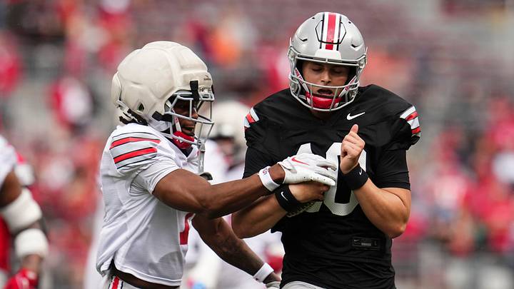 Cornerback Jermaine Mathews Jr. (7) tackles quarterback Julian Sayin (10) during the Ohio State football spring game at Ohio Stadium in Columbus on April 18, 2026. Cornerback Jermaine Mathews Jr. (7) tackles quarterback Julian Sayin (10) during the Ohio State football spring game at Ohio Stadium in Columbus on April 18, 2026.