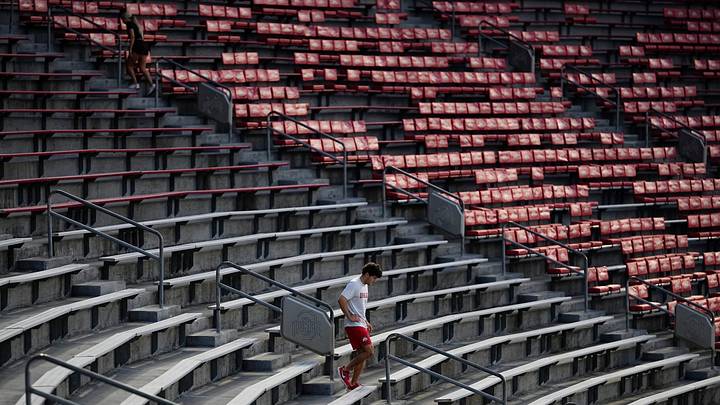Tyler Wisman walks back down after a sprint up the stadium steps during a 6am conditioning workout at Ohio Stadium on Aug. 25, 2025. Tyler Wisman walks back down after a sprint up the stadium steps during a 6am conditioning workout at Ohio Stadium on Aug. 25, 2025.