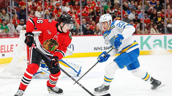 Apr 11, 2026; Chicago, Illinois, USA; Chicago Blackhawks center Anton Frondell (16) battles for the puck with St. Louis Blues defenseman Logan Mailloux (23) during the first period at United Center. Mandatory Credit: Kamil Krzaczynski-Imagn Images Apr 11, 2026; Chicago, Illinois, USA; Chicago Blackhawks center Anton Frondell (16) battles for the puck with St. Louis Blues defenseman Logan Mailloux (23) during the first period at United Center. Mandatory Credit: Kamil Krzaczynski-Imagn Images