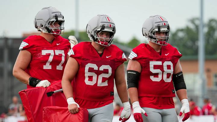 Ohio State Buckeyes offensive linemen Sam Greer (77), Joshua Padilla (62) and Gabe Vansickle (58) line up during the first practice of training camp at the Woody Hayes Athletic Center in Columbus on Aug. 6, 2026.