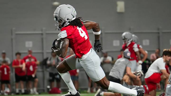 Ohio State Buckeyes wide receiver Jeremiah Smith (4) runs after a catch during football training camp inside the Woody Hayes Athletic Center in Columbus on Aug. 7, 2026. Ohio State Buckeyes wide receiver Jeremiah Smith (4) runs after a catch during football training camp inside the Woody Hayes Athletic Center in Columbus on Aug. 7, 2026.