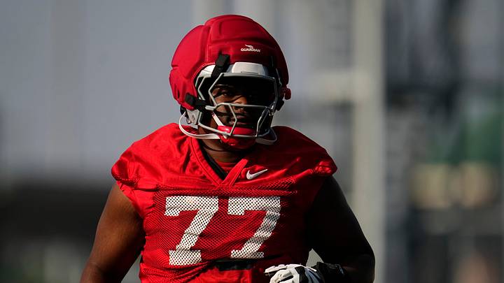 Ohio State Buckeyes offensive lineman Tegra Tshabola (77) runs during football training camp at the Woody Hayes Athletic Center on Aug. 1, 2025. Ohio State Buckeyes offensive lineman Tegra Tshabola (77) runs during football training camp at the Woody Hayes Athletic Center on Aug. 1, 2025.