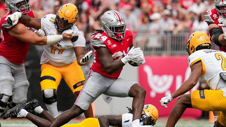 Ohio State Buckeyes running back Ja'kobi Jackson (24) runs at Kent State Golden Flashes defensive back Joel Cordoba (2) during the NCAA football game at Ohio Stadium in Columbus on Sept. 19, 2026. Ohio State won 59-3.