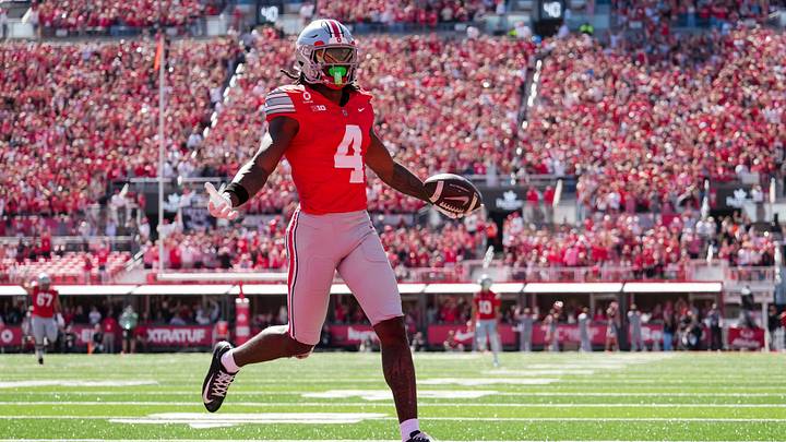 Ohio State Buckeyes wide receiver Jeremiah Smith (4) scores a touchdown during the NCAA football game against the Illinois Fighting Illini at Ohio Stadium in Columbus on Sept. 26, 2026.